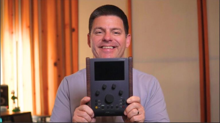Mixing engineer Matty Harris holding the Softube Flow controller